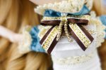 Detail of the big bow attached to the blue dress.